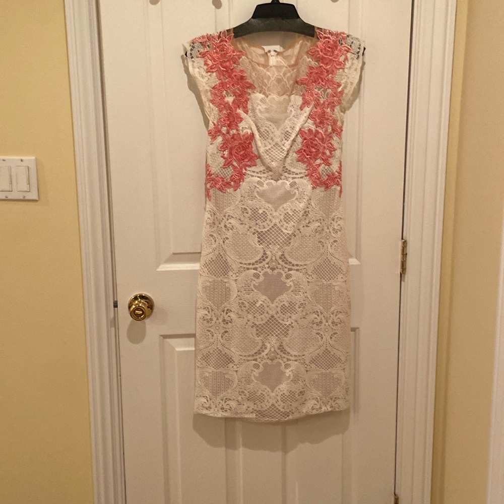 White lace dress with pink sequence flowers